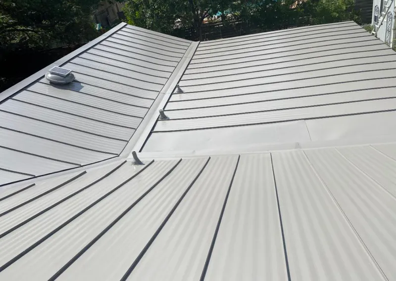 Solar attic fan installed on a metal roof for Roof Ventilation in California City